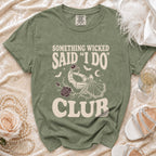 Green t-shirt with "Something Wicked Said I Do Club" text and skeleton hand holding a ring.