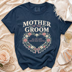 Navy t-shirt with "Mother of the Groom" text and floral heart design.