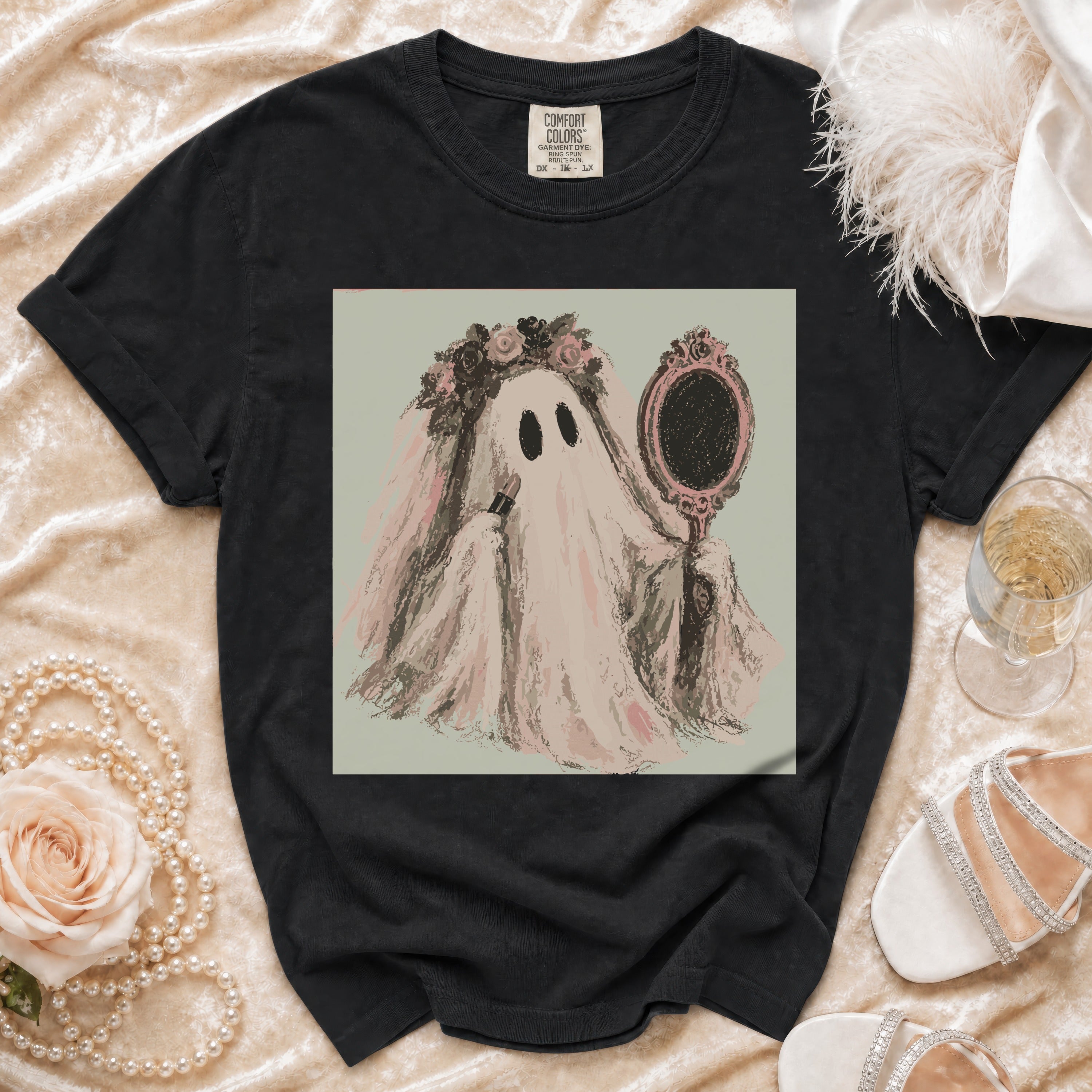 Black t-shirt with graphic of a ghost with a flower crown holding lipstick and a mirror.
