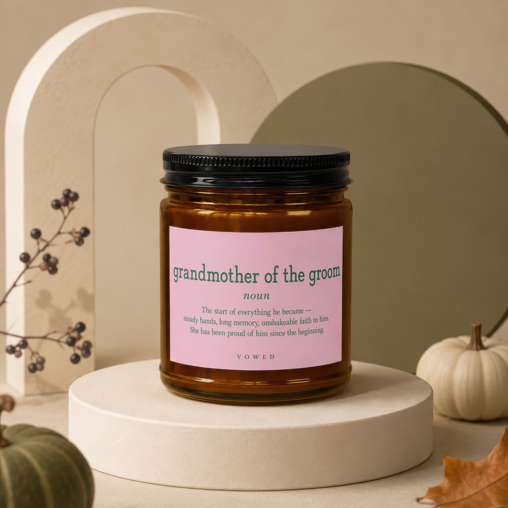 Candle jar with pink label defining "grandmother of the groom" and a quote.