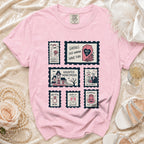 Pink t-shirt with six Halloween-themed postage stamps depicting spooky bridal and wedding imagery.