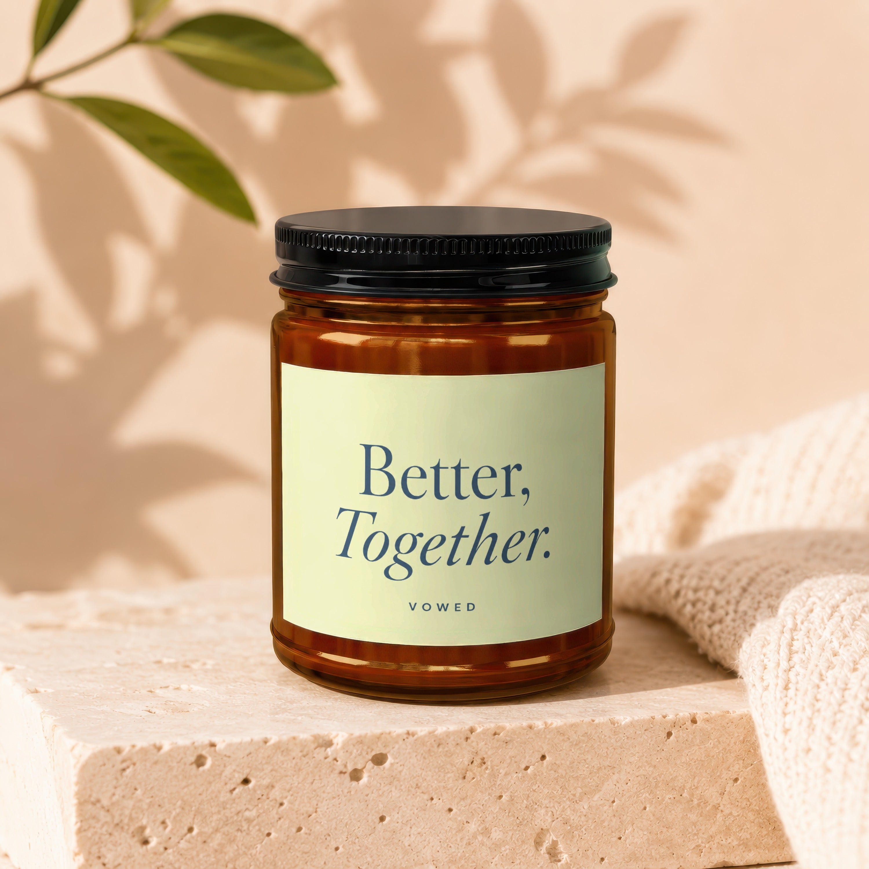 Amber jar candle with a black lid and cream label reading "Better, Together. VOWED."