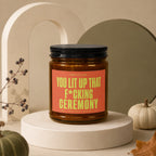 Brown candle with "YOU LIT UP THAT F*CKING CEREMONY" on the label.