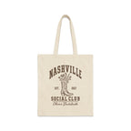 Beige canvas tote bag featuring brown retro text that reads Nashville Social Club, Olivia's Bachelorette, and a cowboy boot graphic.