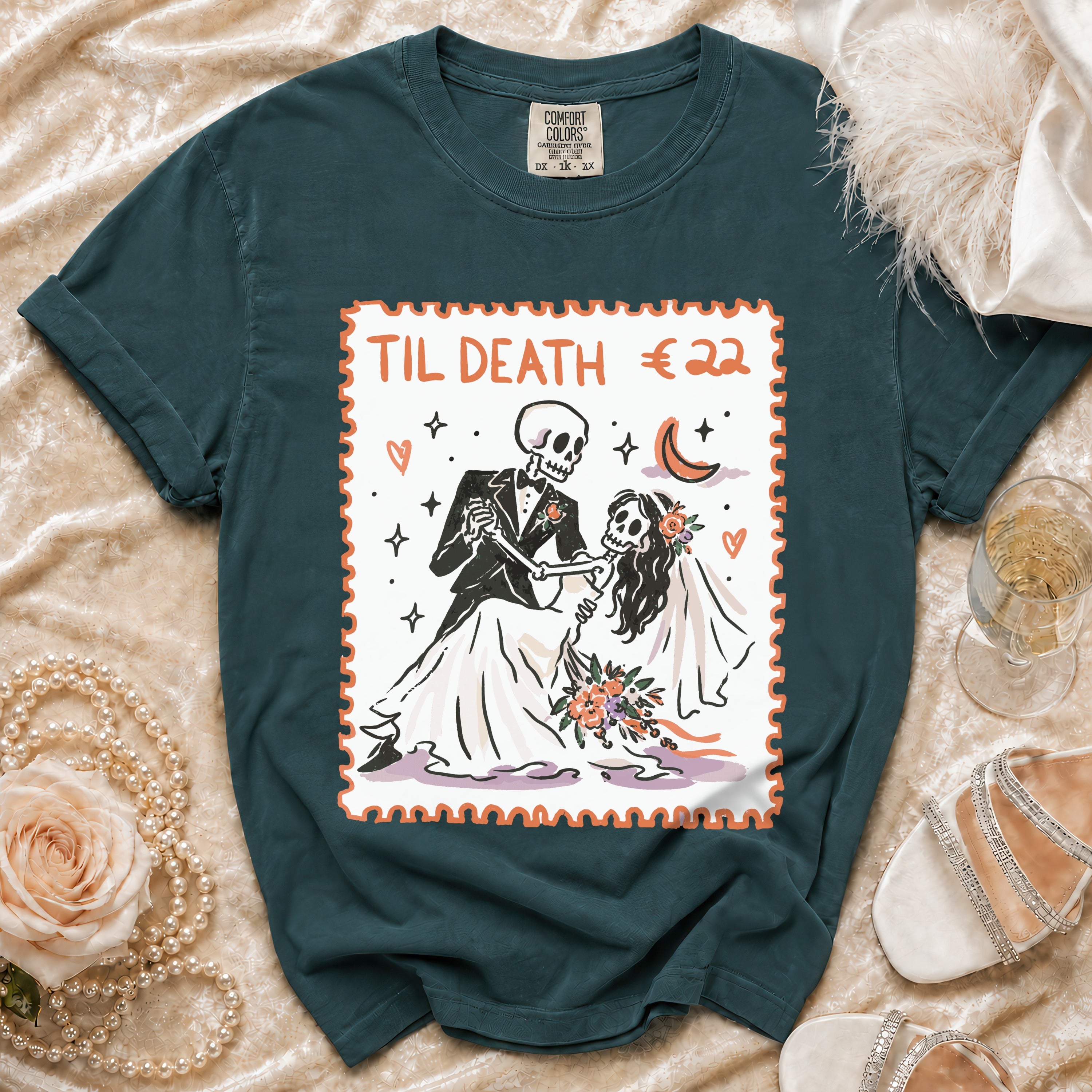 Dark green graphic t-shirt featuring a postage stamp design of a skeleton couple dancing with the text "TIL DEATH".