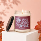 Candle with text "The gays are getting married vowed" on a marble pedestal.