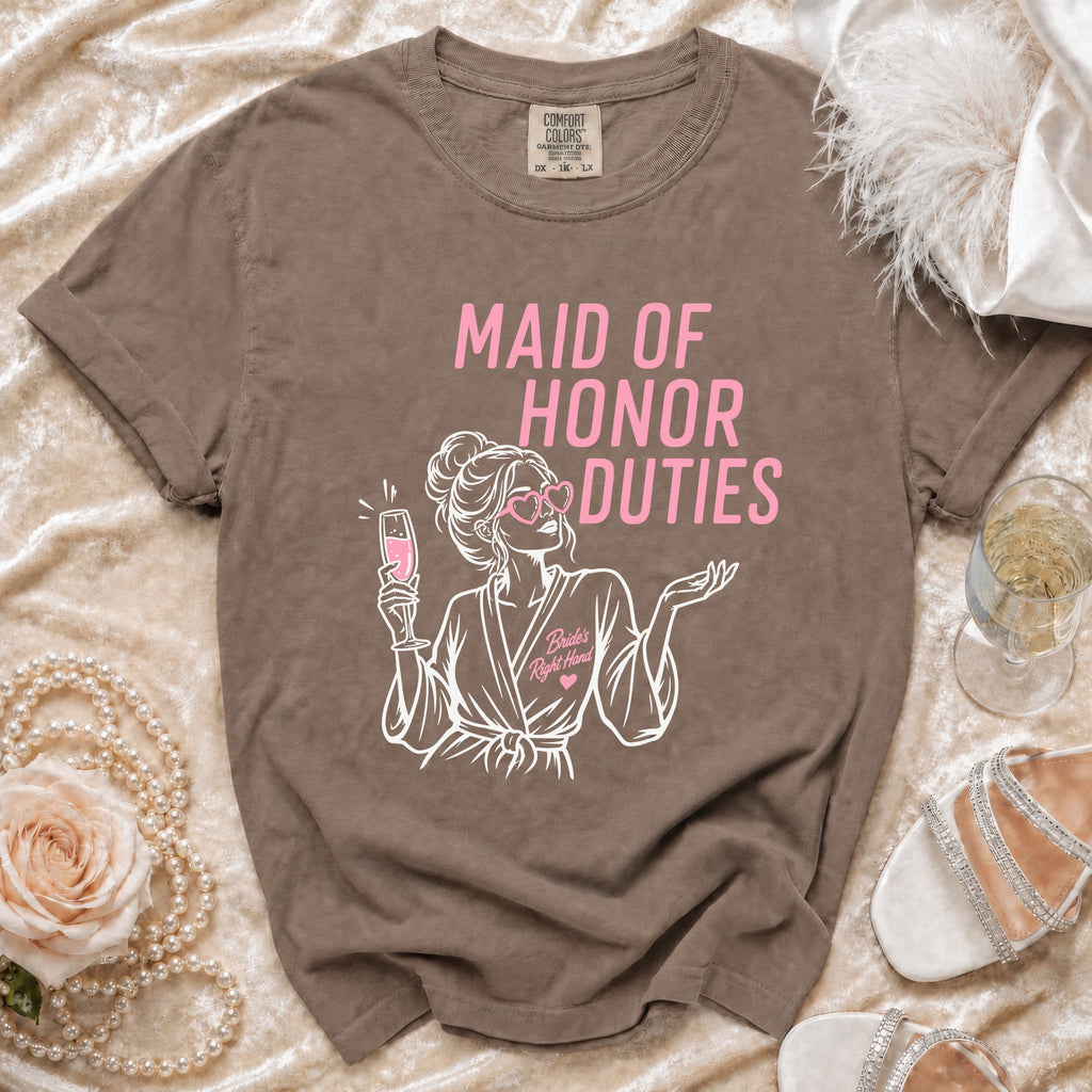 Brown t-shirt with "Maid of Honor Duties" text and graphic of a woman holding champagne.