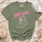 Green t-shirt with pink text "Bride to Boo Screaming Club" and ghost bride graphic.