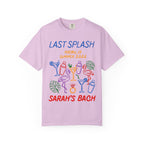 Lilac t-shirt with "Last Splash" and "Sarah's Bach" text and colorful drink and flamingo graphics.