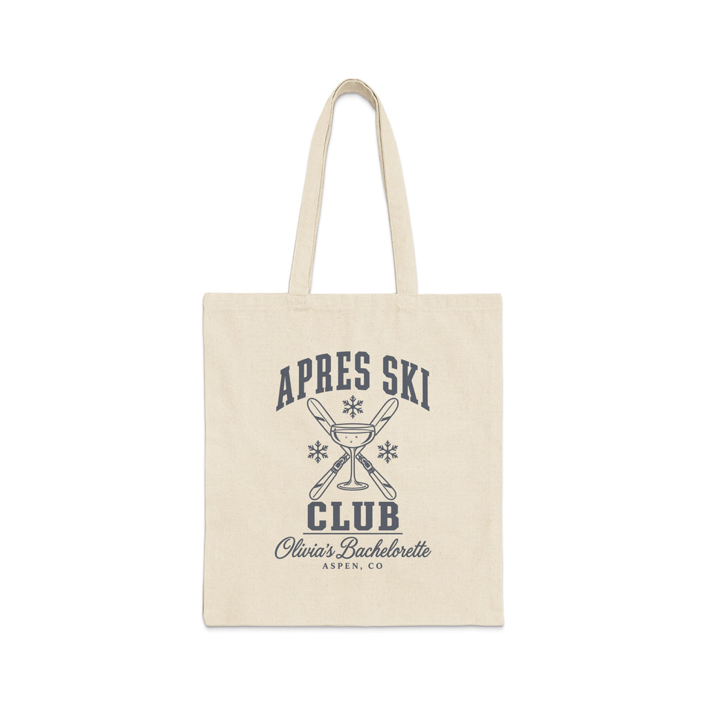 A natural canvas tote bag with a black printed graphic featuring crossed skis, a champagne glass, and the text Apres Ski Club Olivia's Bachelorette Aspen, CO.