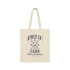 A natural canvas tote bag with a black printed graphic featuring crossed skis, a champagne glass, and the text Apres Ski Club Olivia's Bachelorette Aspen, CO.