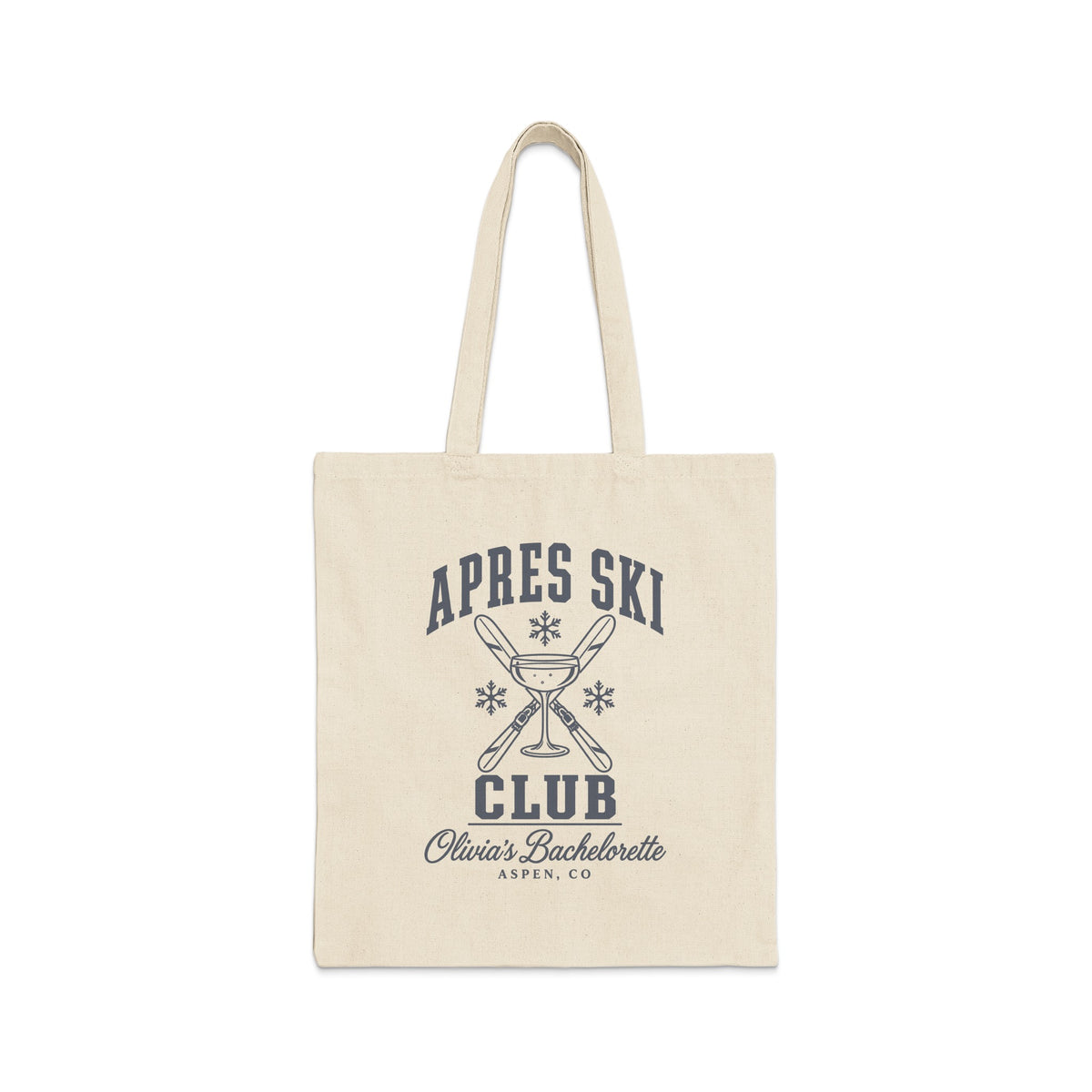 A natural canvas tote bag with a black printed graphic featuring crossed skis, a champagne glass, and the text Apres Ski Club Olivia's Bachelorette Aspen, CO.