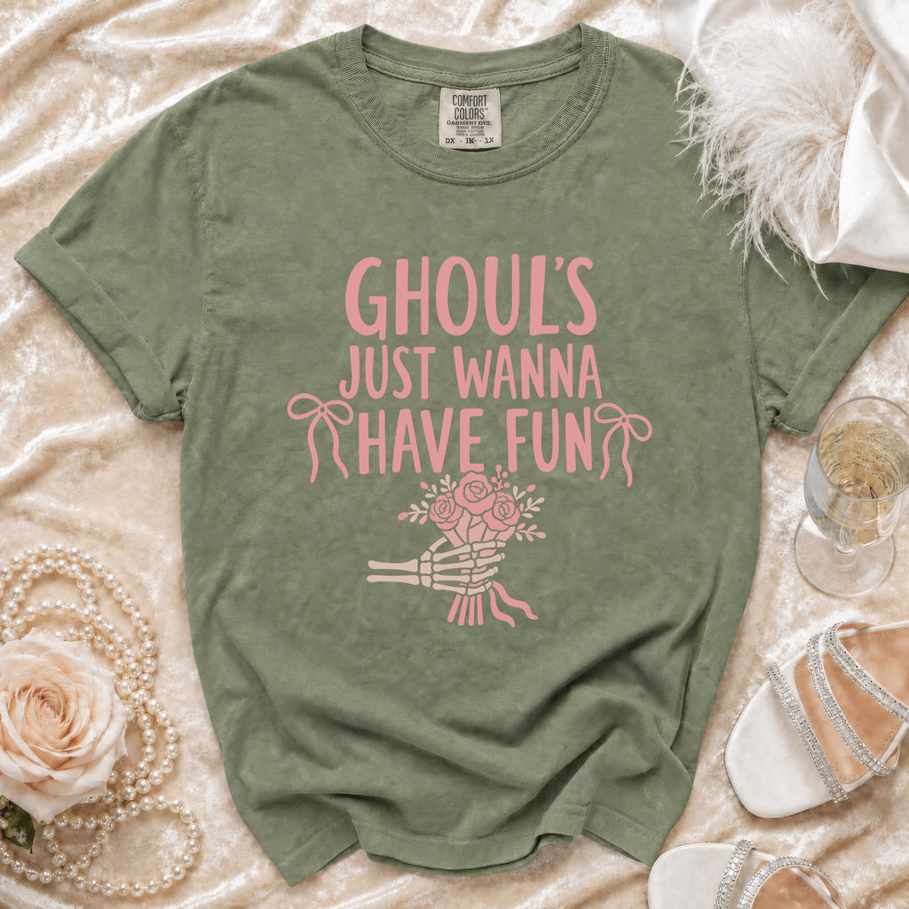Green t-shirt with pink text "GHOUL'S JUST WANNA HAVE FUN" and skeleton hand holding flowers.