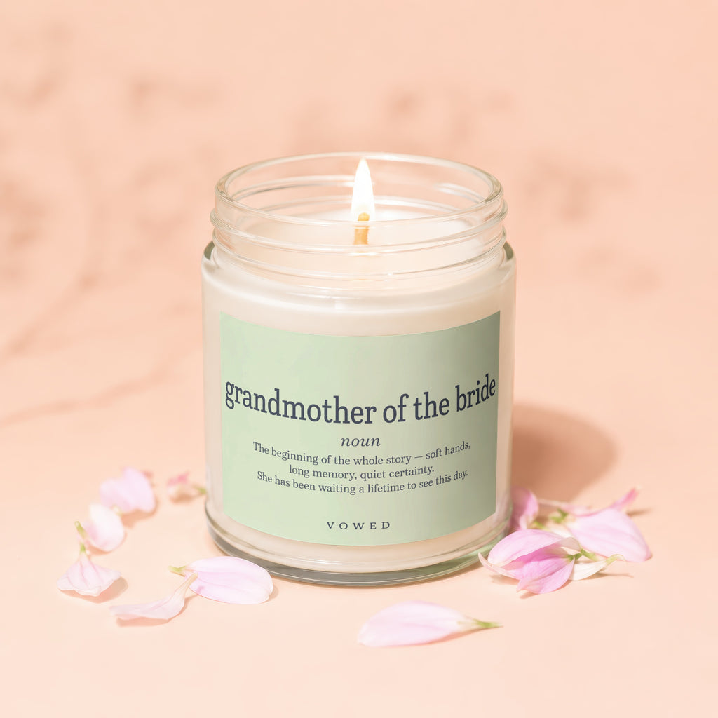 Candle labeled "grandmother of the bride" with definition and floral accents.