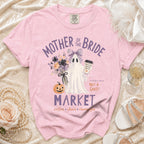 Pink shirt with "Mother of the Bride" and a ghost holding a coffee cup.