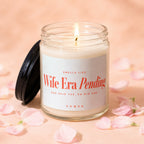 Lit candle in a glass jar with lid askew, label reads "Wife Era Pending."