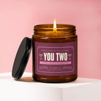 Engagement candle with "YOU TWO" text, celebratory messaging, and soy wax blend.