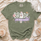 Green t-shirt with ghost bride graphic and "BRIDE TO BOO-TIFUL" text.