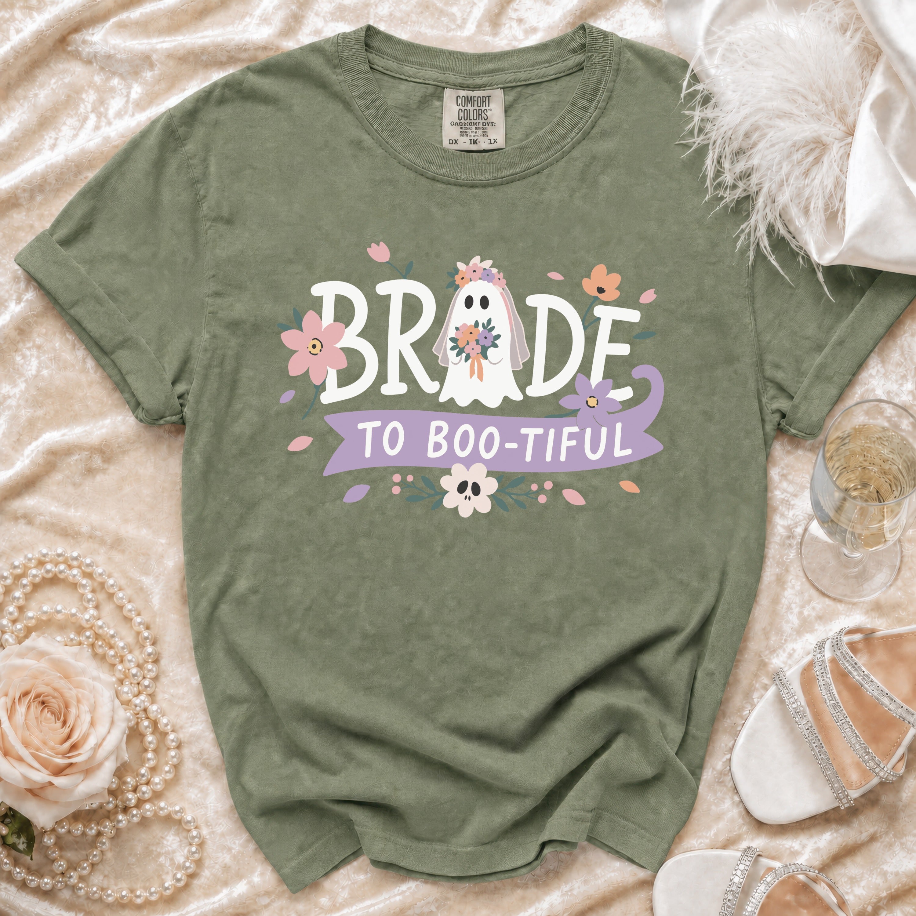 Green t-shirt with ghost bride graphic and "BRIDE TO BOO-TIFUL" text.
