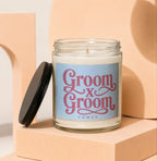 Groom x Groom Vowed candle in a glass jar with a black lid.