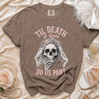 Brown t-shirt with skull wearing a floral veil, reading "Til Death & taxes do us part".