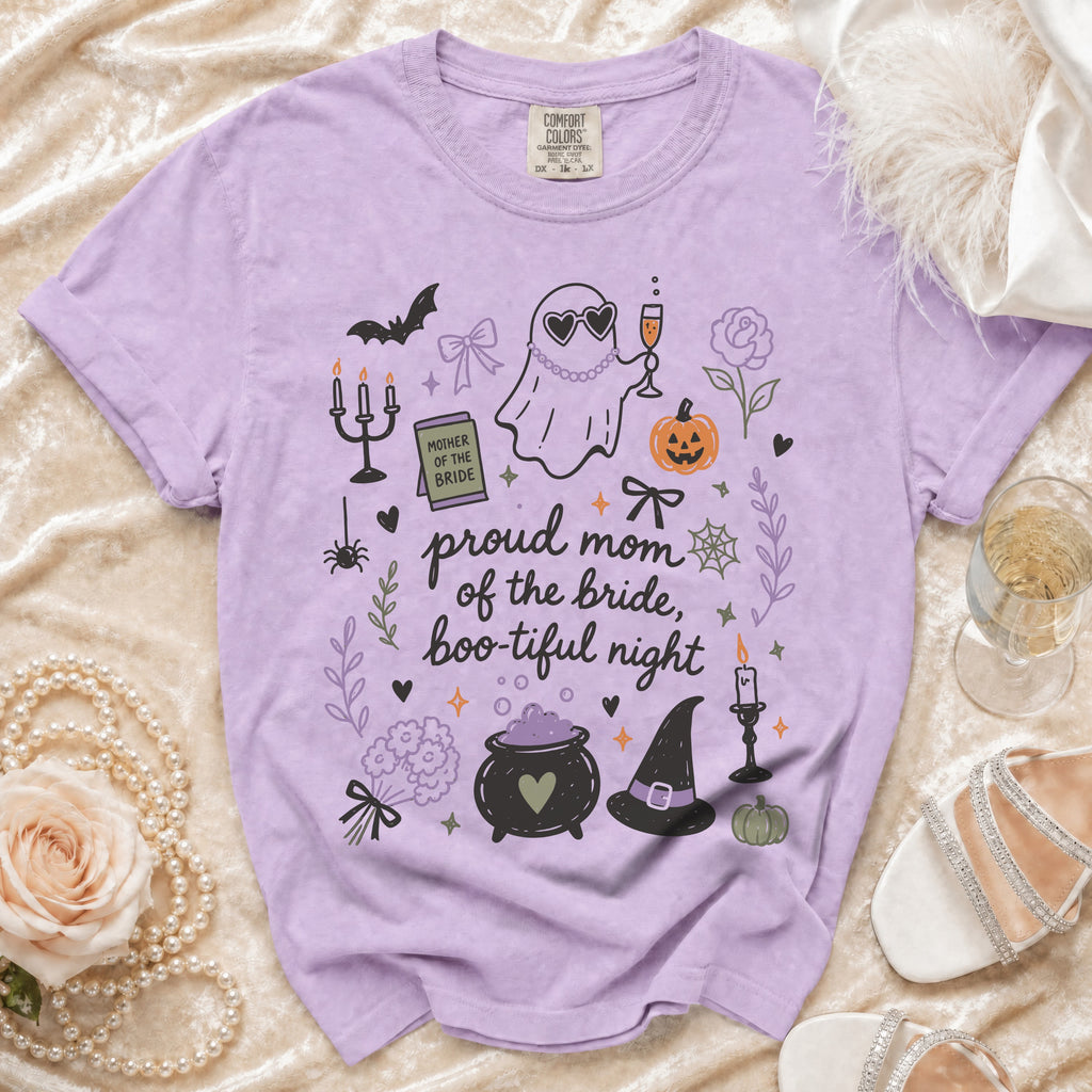 Purple t-shirt with "proud mom of the bride, boo-tiful night" and Halloween graphics.
