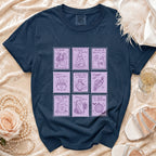 Navy t-shirt with nine purple postage stamp style graphics of spooky wedding and engagement themes.
