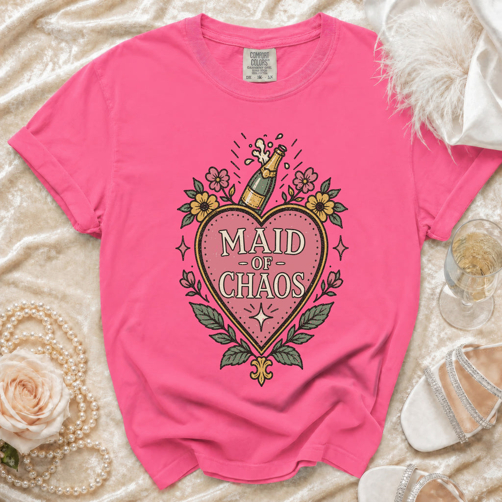 Pink t-shirt with "Maid of Chaos" heart graphic and champagne bottle design.