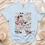 Light blue t-shirt with "Bride to Be" text and wedding-themed illustrations.