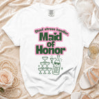 White t-shirt with "Maid of Honor" and "Chief stress handler" text and champagne illustration.