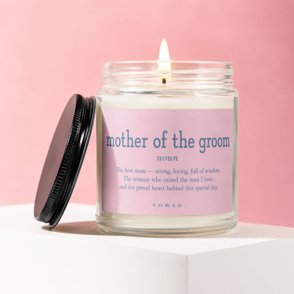 Candle with pink label reads "mother of the groom noun" and a descriptive quote.