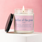 Candle with pink label reads "mother of the groom noun" and a descriptive quote.
