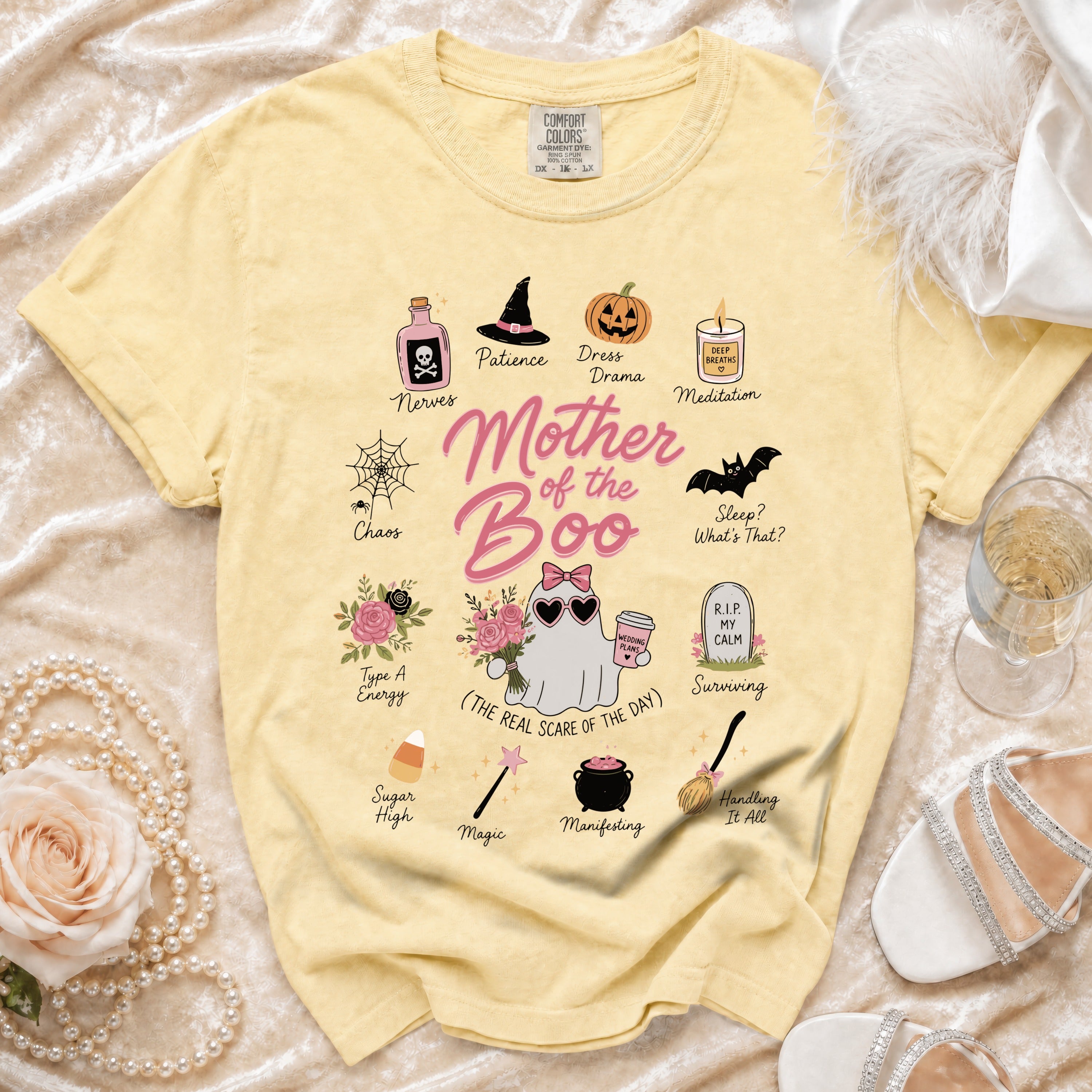 Yellow t-shirt with "Mother of the Boo" graphic and Halloween-themed illustrations.