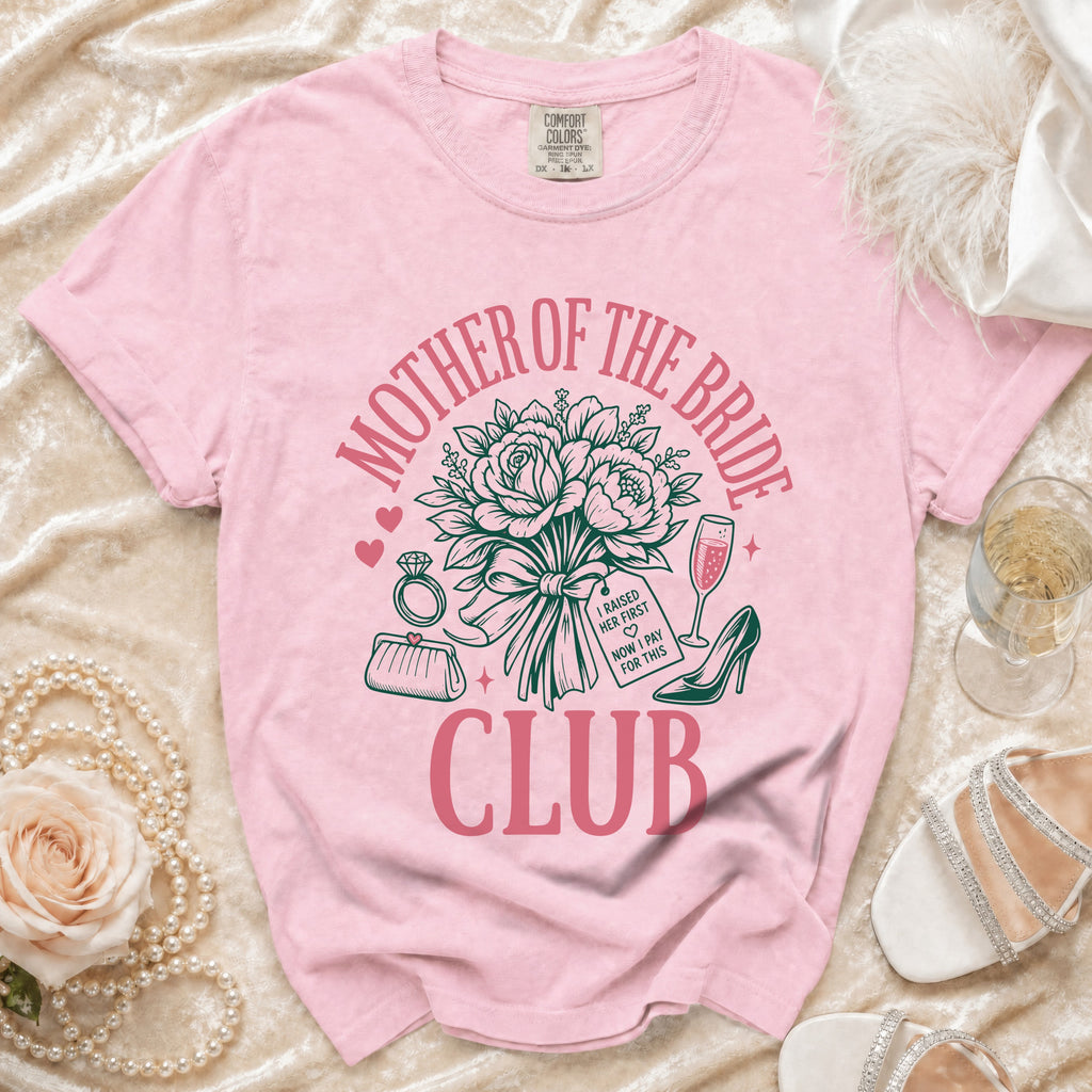 Pink t-shirt with "Mother of the Bride Club" text and wedding accessories design.
