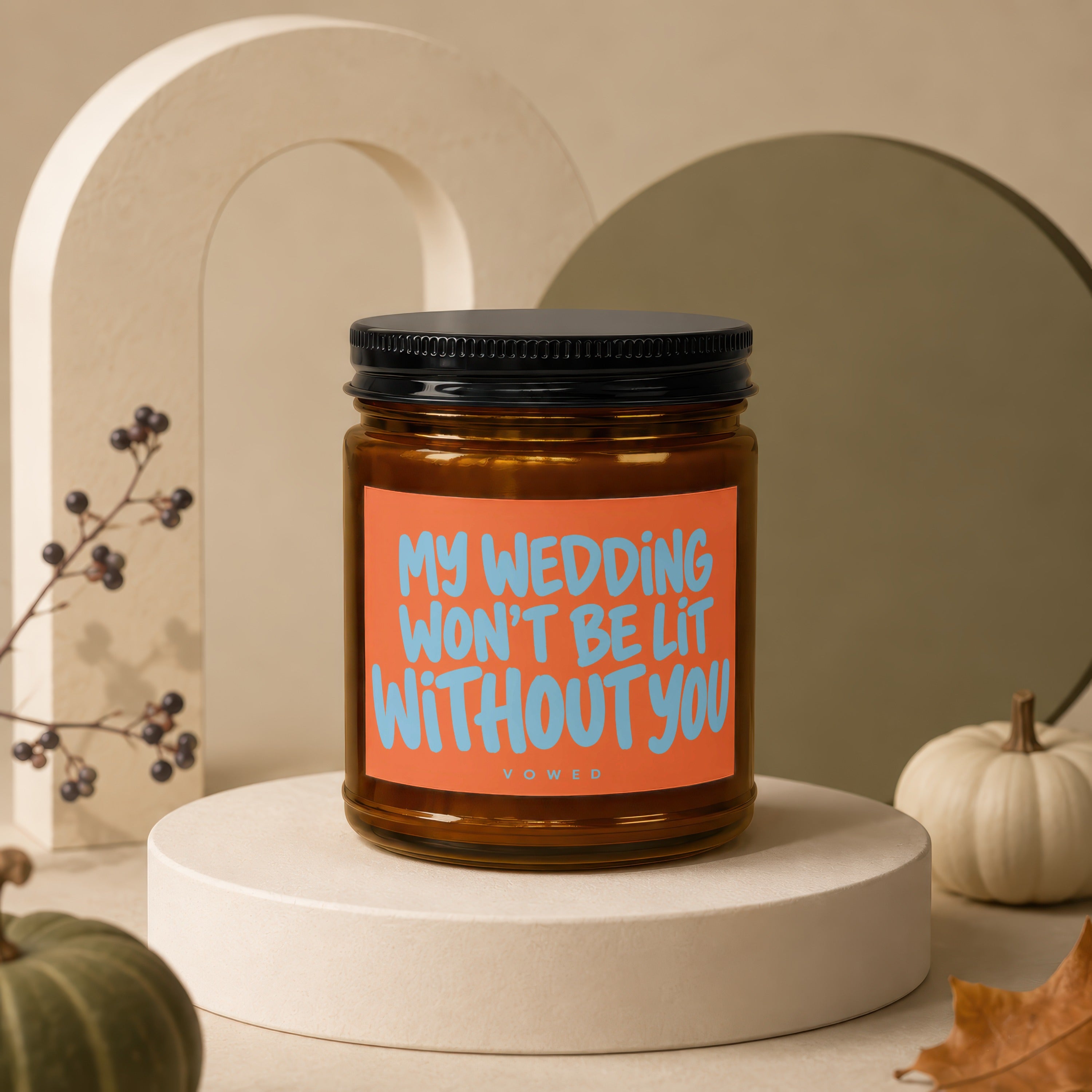 Candle with orange label reading "MY WEDDING WON'T BE LIT WITHOUT YOU".