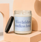 Glass candle with lavender label reading "Two brides, endless love"