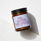 Amber jar candle with lavender label reading "The grooms have entered" and "VOWED".