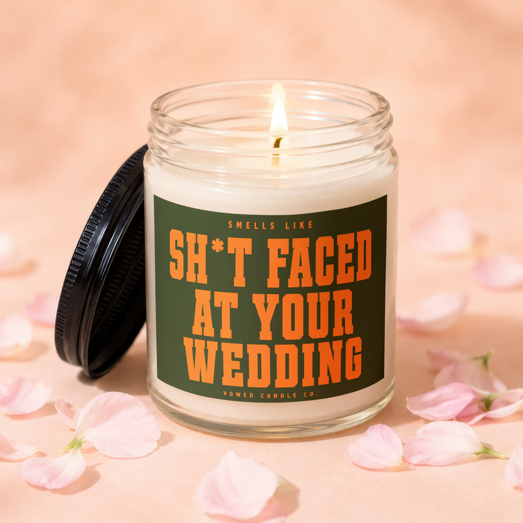 Candle with label "Smells like SH*T FACED AT YOUR WEDDING" by Vowed Candle Co.