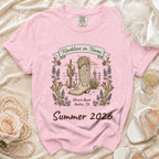 Pink t-shirt with "Reckless in Texas" and desert boot graphic for Summer 2026.