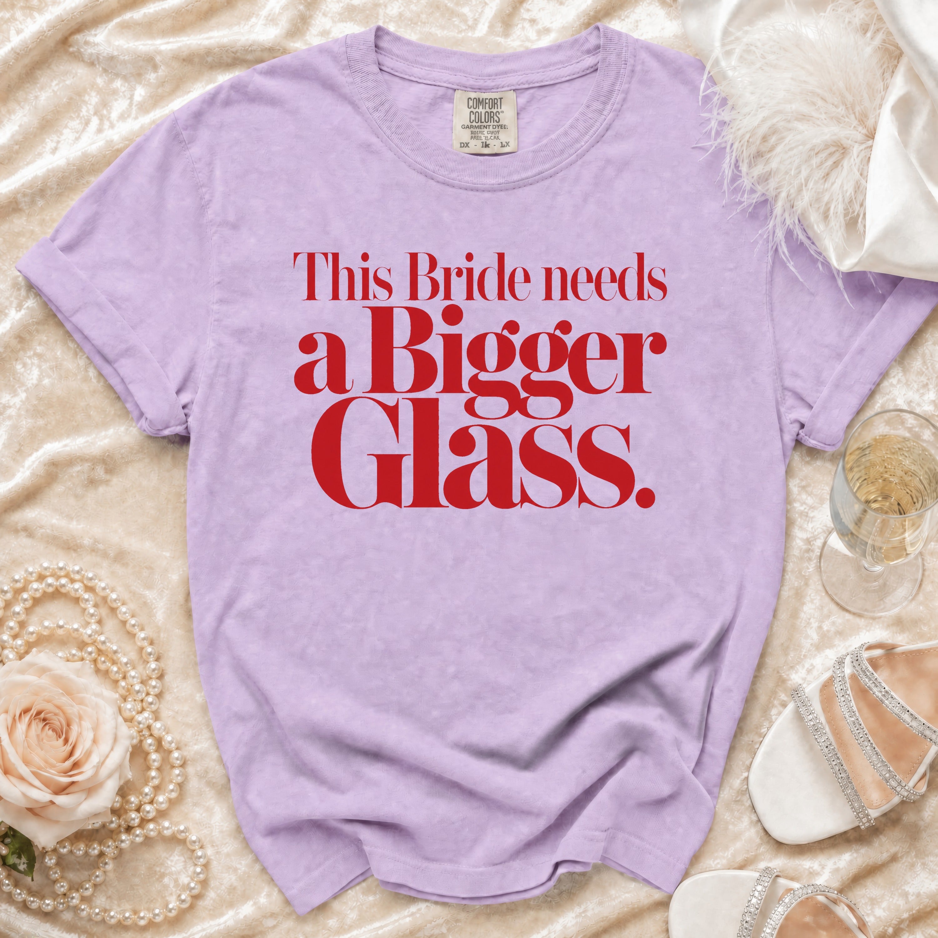 Lavender t-shirt with red text "This Bride needs a Bigger Glass."