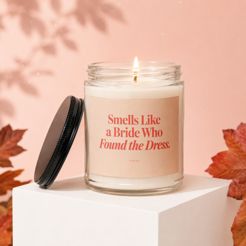 Glass candle with text "Smells Like a Bride Who Found the Dress."