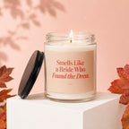 Glass candle with text "Smells Like a Bride Who Found the Dress."