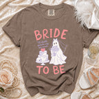 Brown t-shirt with "BRIDE TO BE" text and ghost bride graphic.