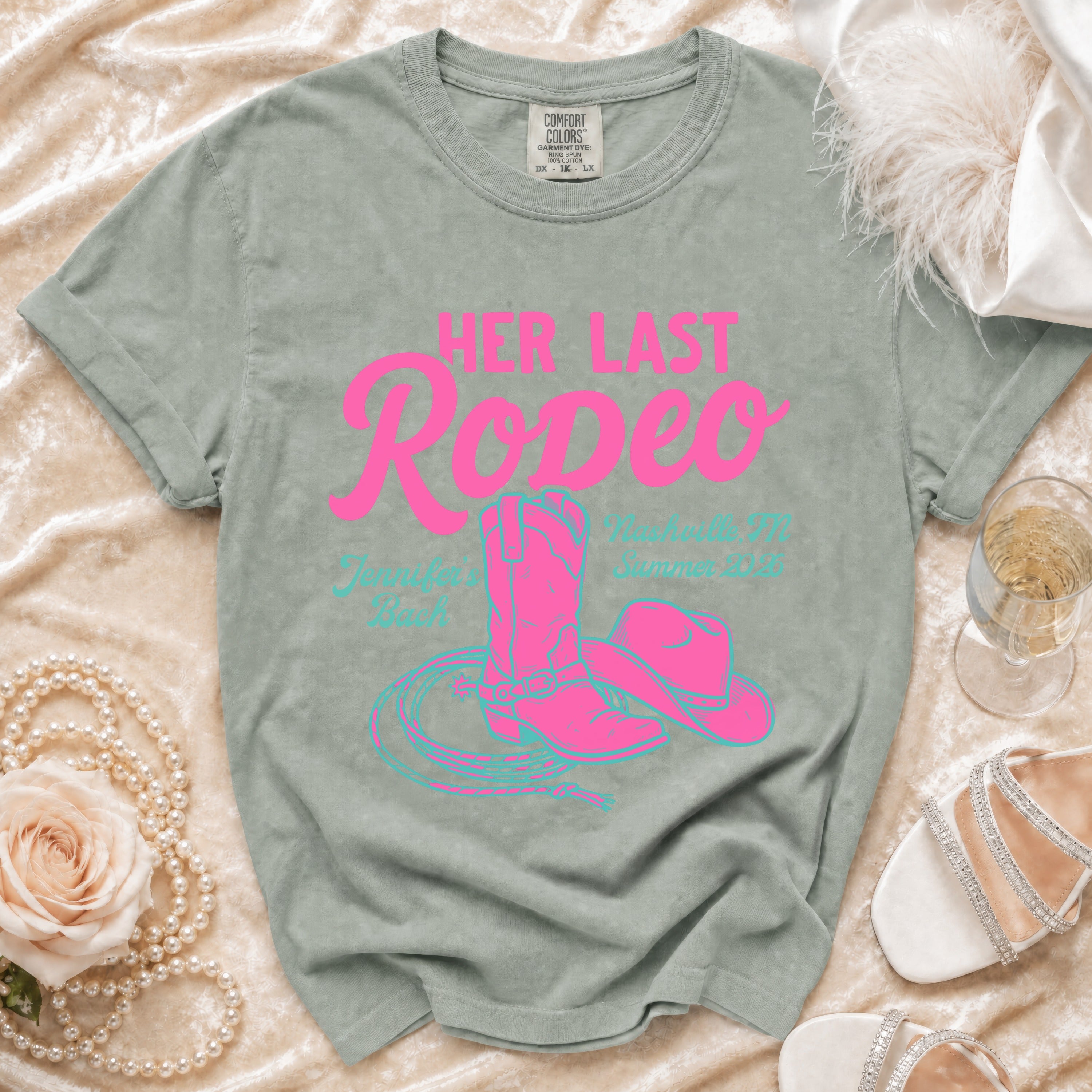 Pink cowboy boots, hat, and lasso on a vintage-style t-shirt with "Her Last Rodeo" text.