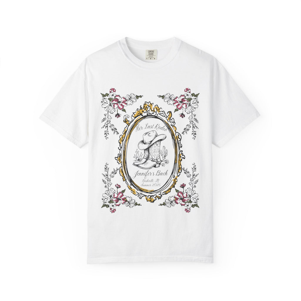 White t-shirt with "Her Last Rodeo" text, cowboy boot, and floral frame.