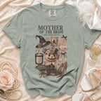 Shirt with Mother of the Bride Halloween graphic: witch hat, pumpkin, candle, and haunted house.