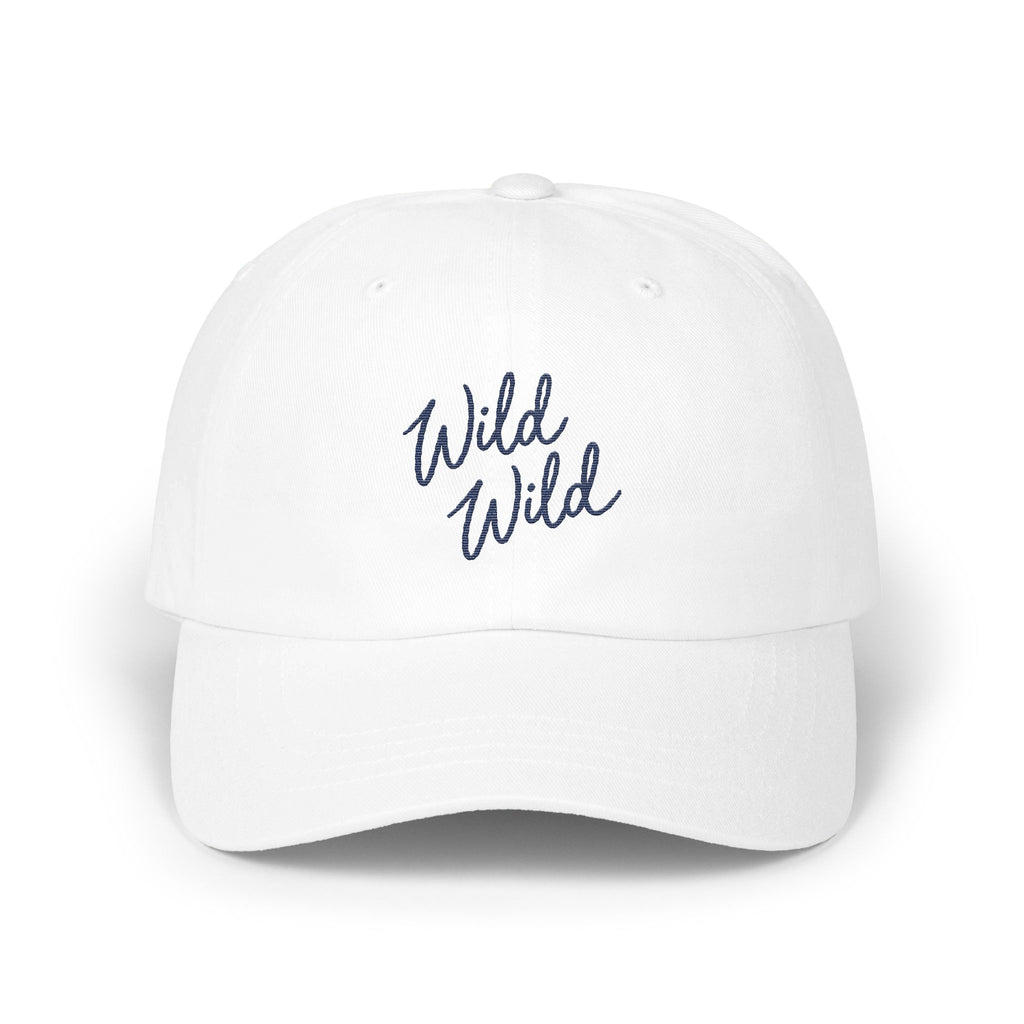 A white baseball cap with the blue embroidered text Wild Wild centered on the front panel.