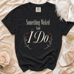 Black Comfort Colors shirt with "Something Wicked Said I Do" text and floral accents.