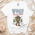 White graphic t-shirt for "Reckless in Texas Olivia's Bach" in Austin, TX.