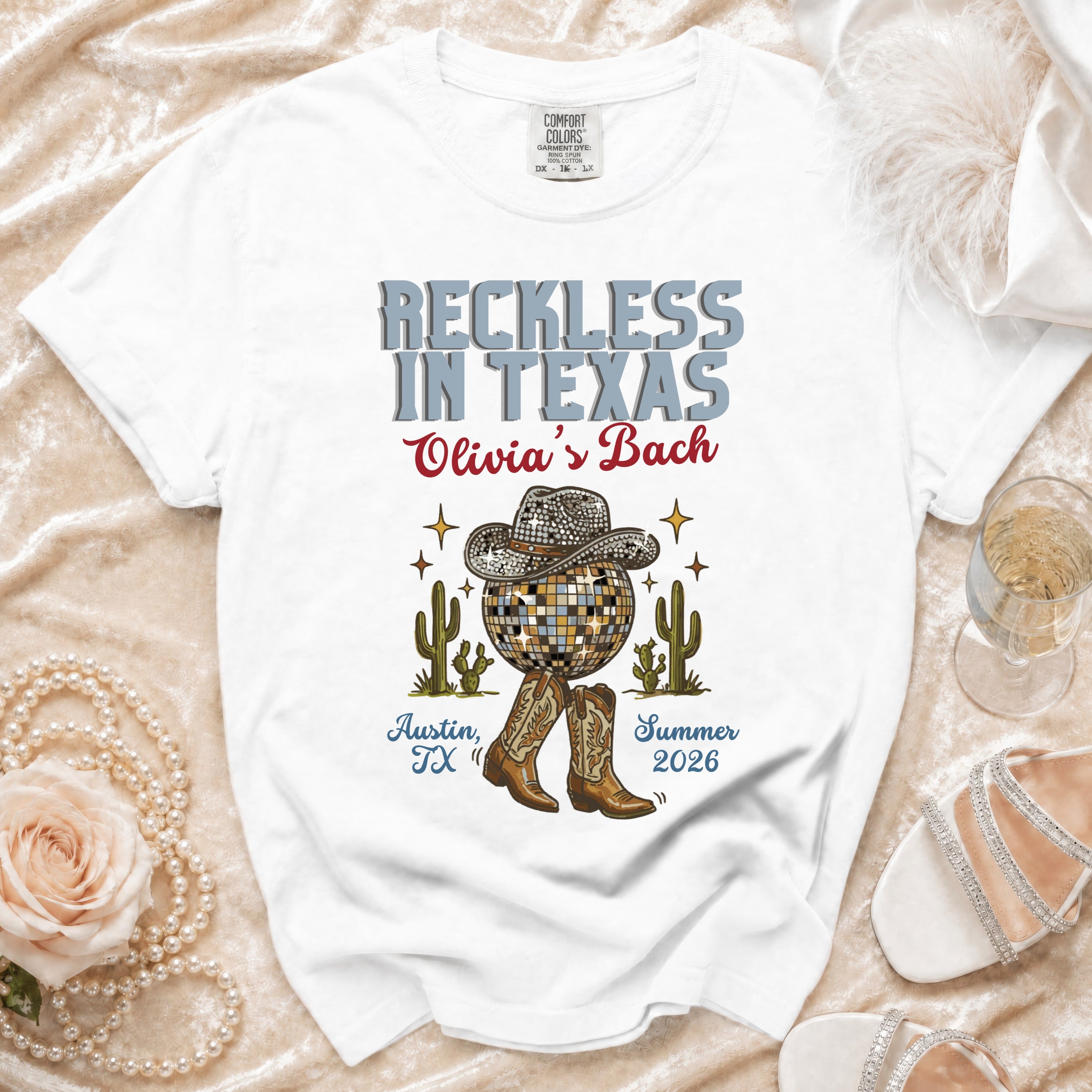 White graphic t-shirt for "Reckless in Texas Olivia's Bach" in Austin, TX.